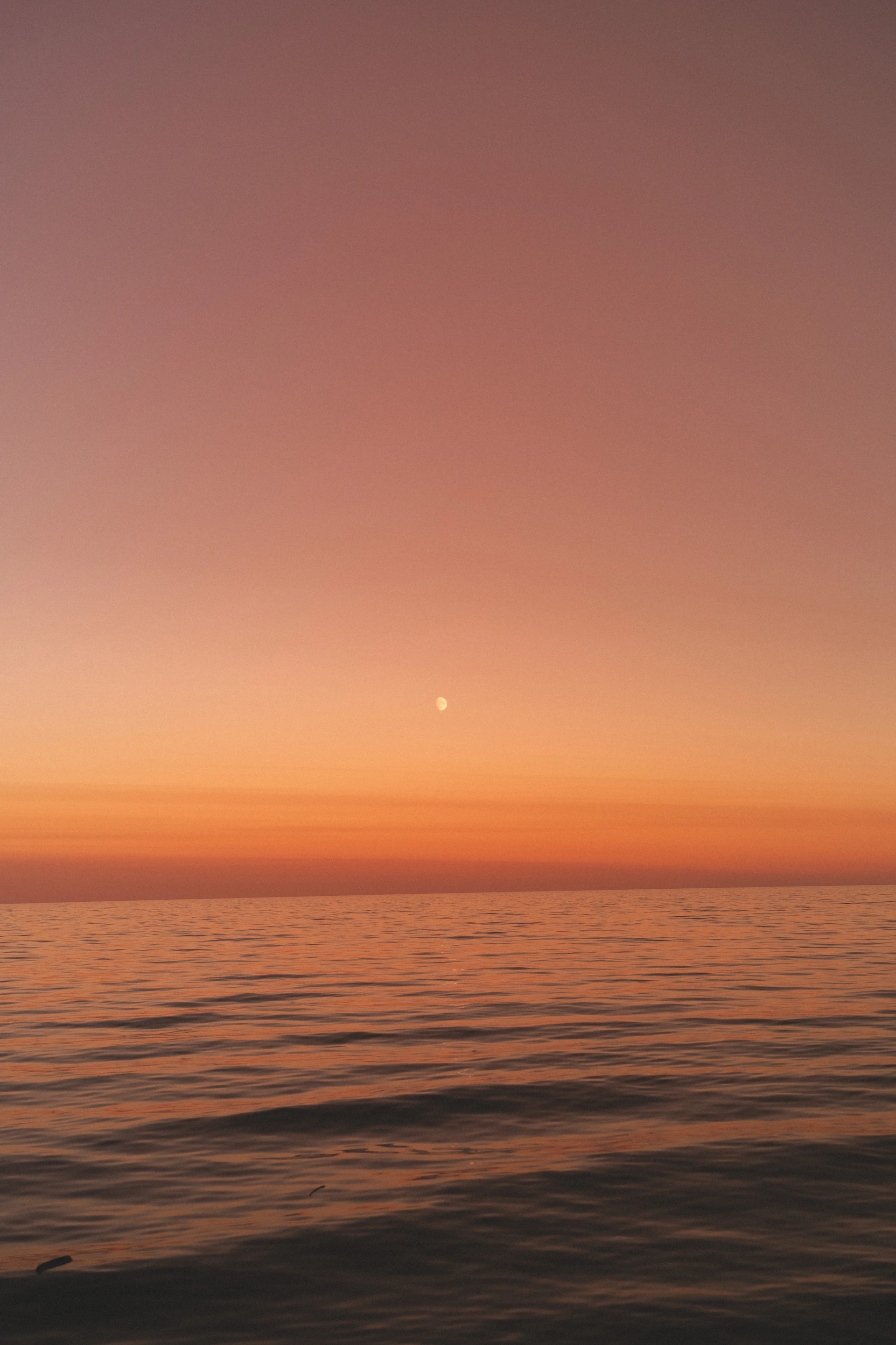 a sunset over a body of water