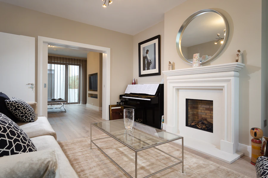 Living room with a fireplace and rich walnut plank flooring