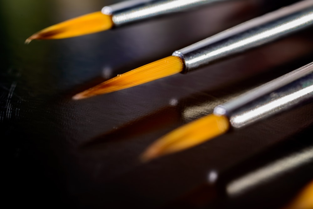 a close-up of a black and yellow pencils