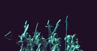 A collection of medieval warrior figurines displayed under soft lighting, highlighting their craftsmanship.