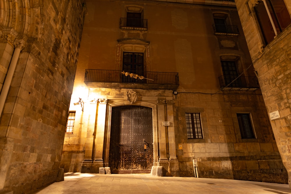 a building with a large door and a balcony