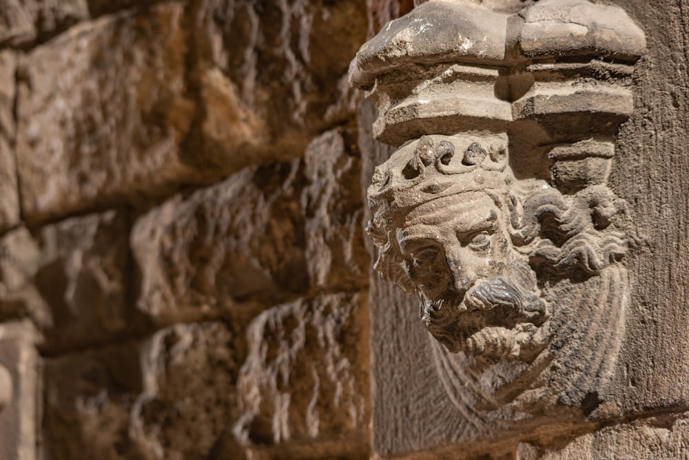 a stone carving of a man and a woman