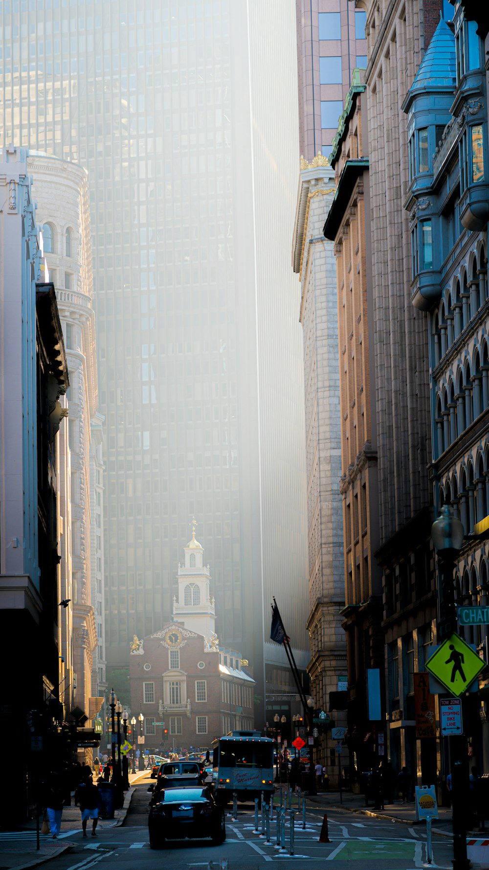 a street with cars and buildings on either side of it