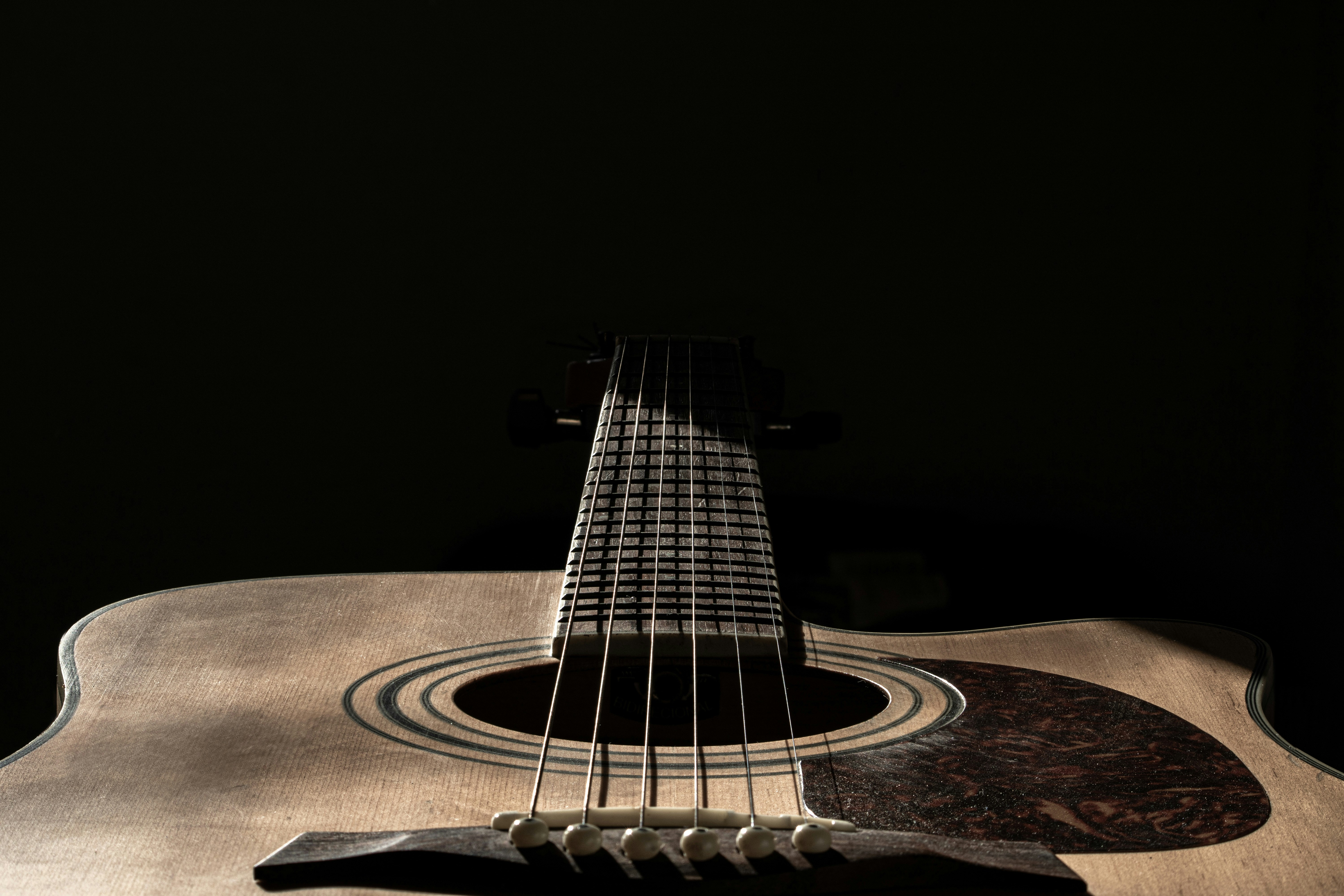 Wood acoustic guitar with dark background
