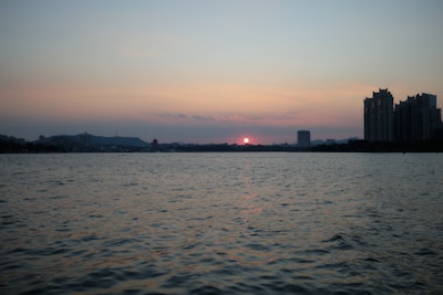 A scenic view of New York City skyline at sunset.