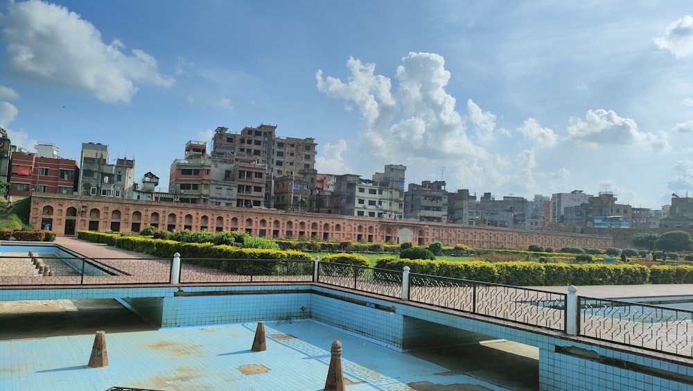 a large building with a pool in front of it