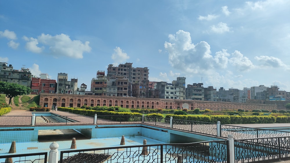 a body of water with buildings in the background