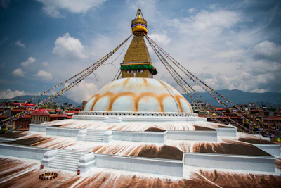 The white dome and gold spire of Boudhanath stupa in Kathmandu