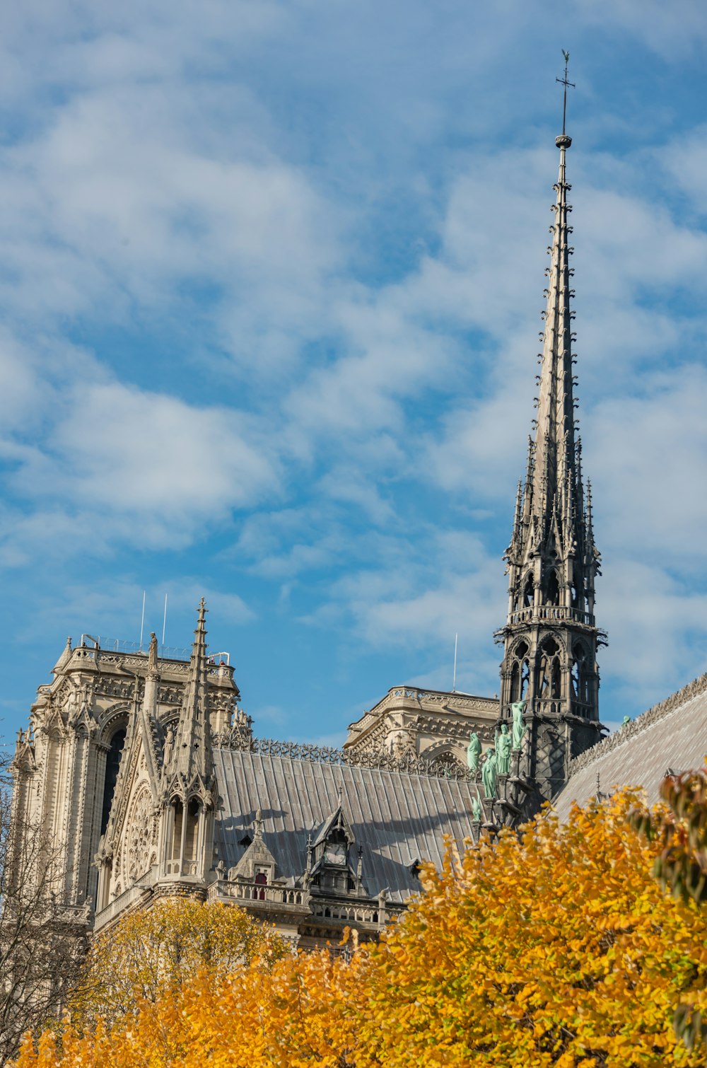 a tall tower with a building in the background