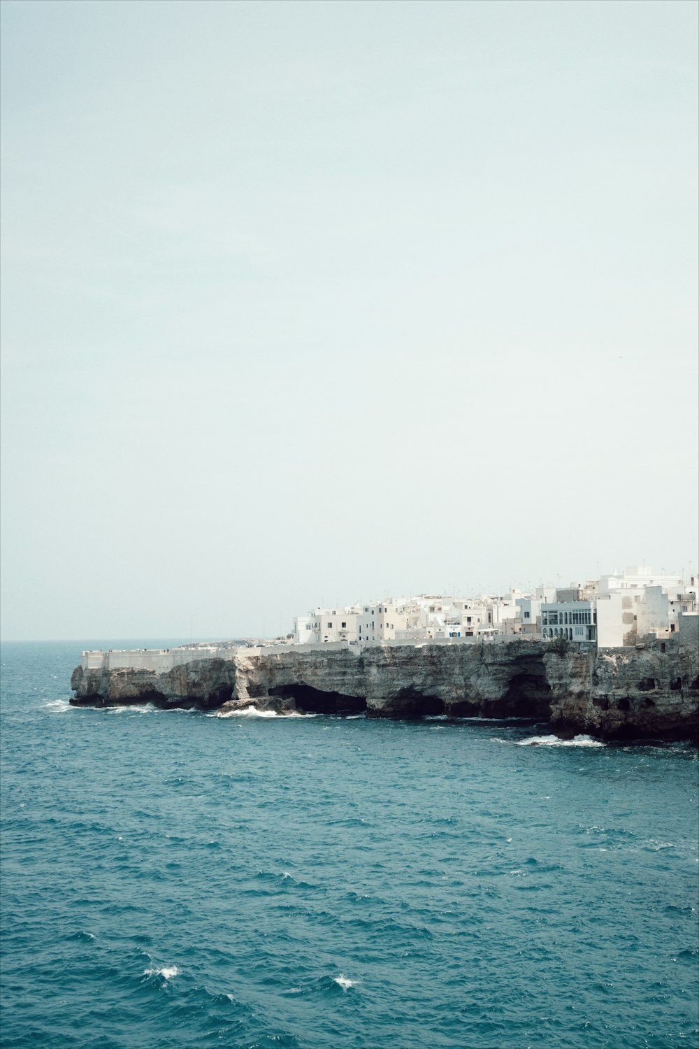 a body of water with buildings on the side