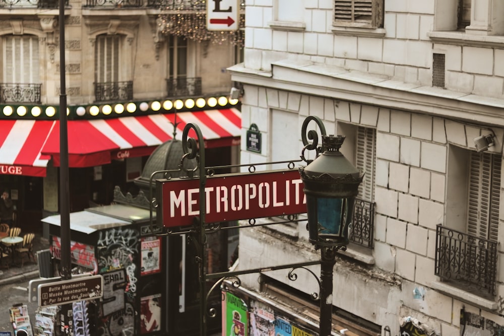 a street sign in front of a restaurant