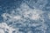 Foamy, churning water in a dynamic motion, capturing the texture and movement of small bubbles and turbulent currents.