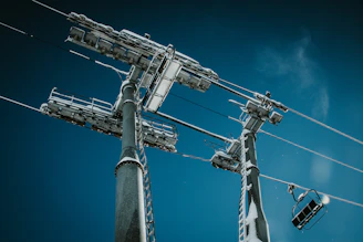 a tall antenna with a blue sky