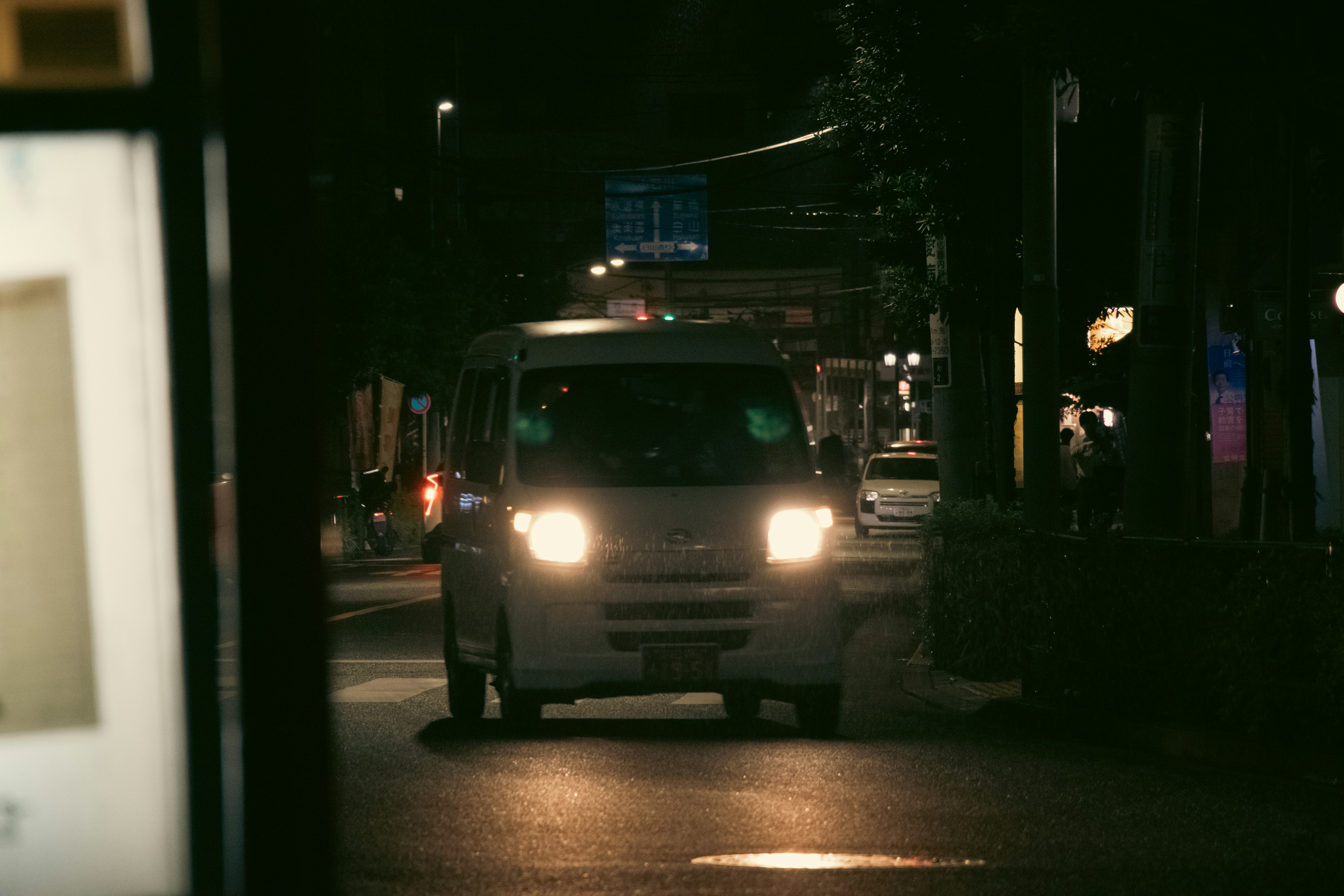 a white truck on a street at night