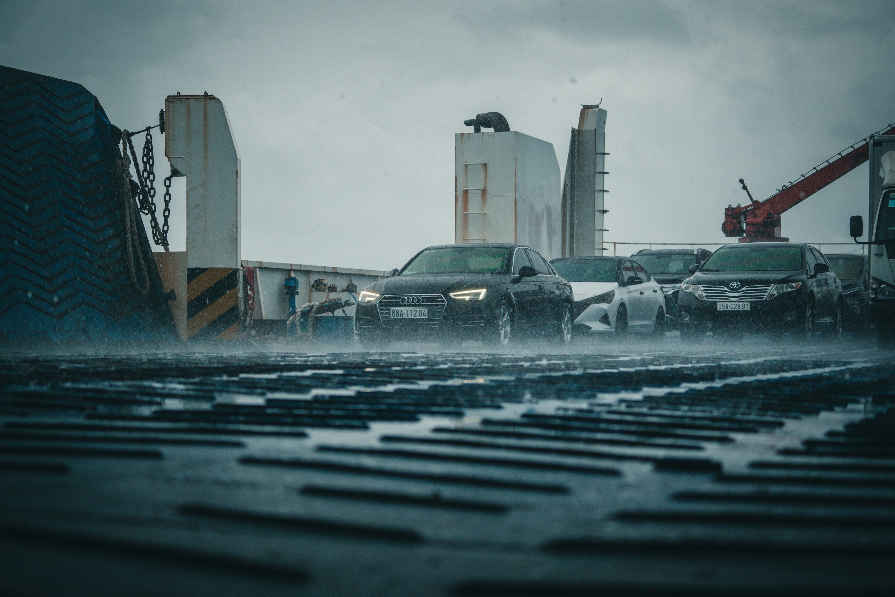 a group of cars driving through water