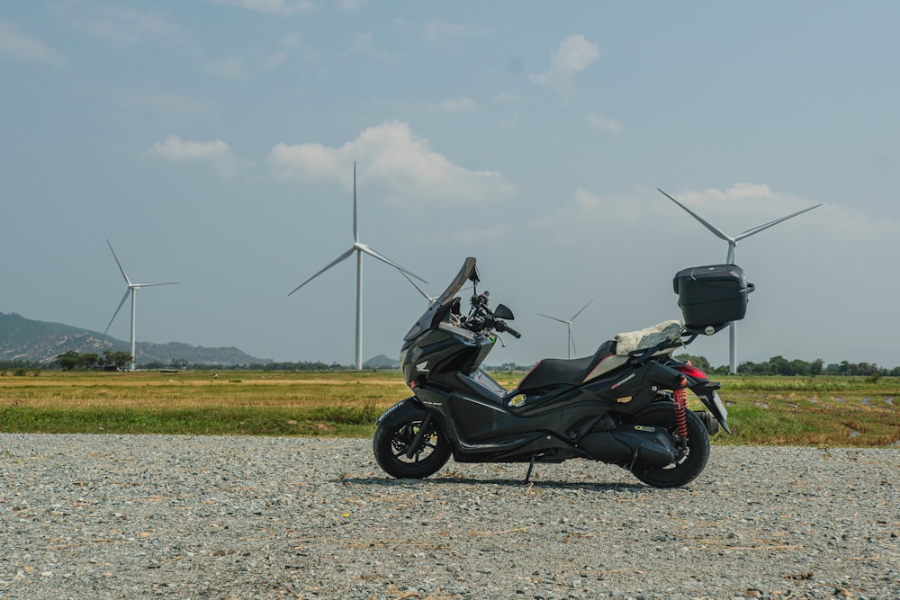 a motorcycle parked on a gravel road