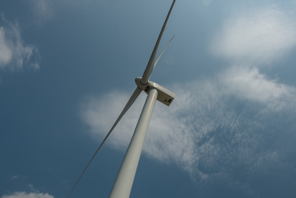 a wind turbine under a blue sky