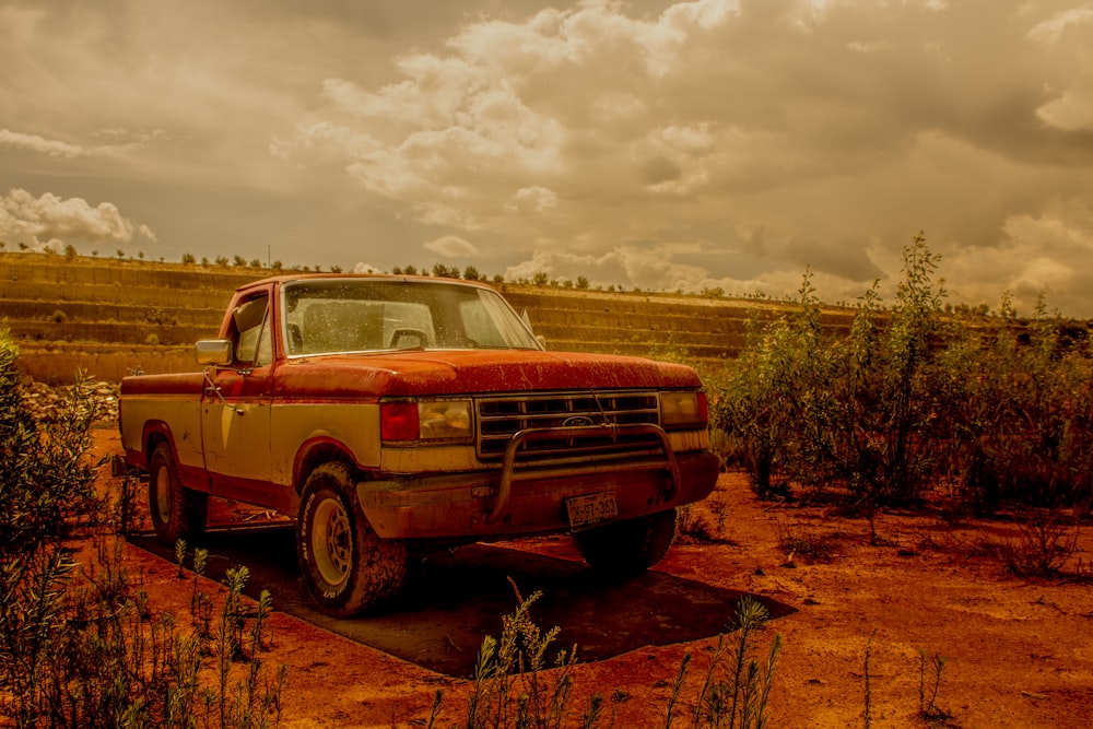 a red truck parked in a field