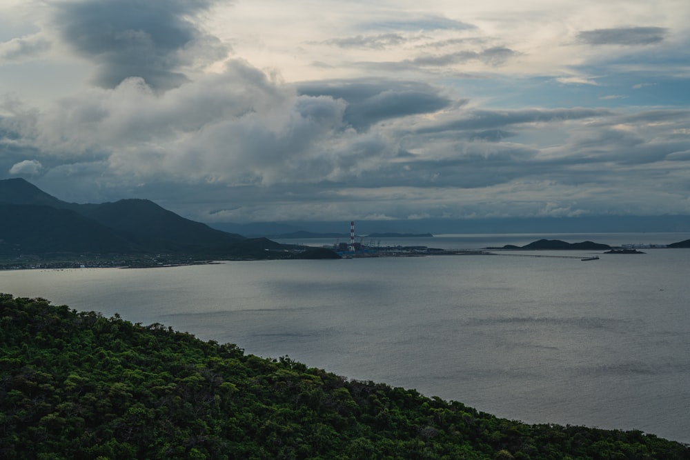 a body of water with land and a boat in it