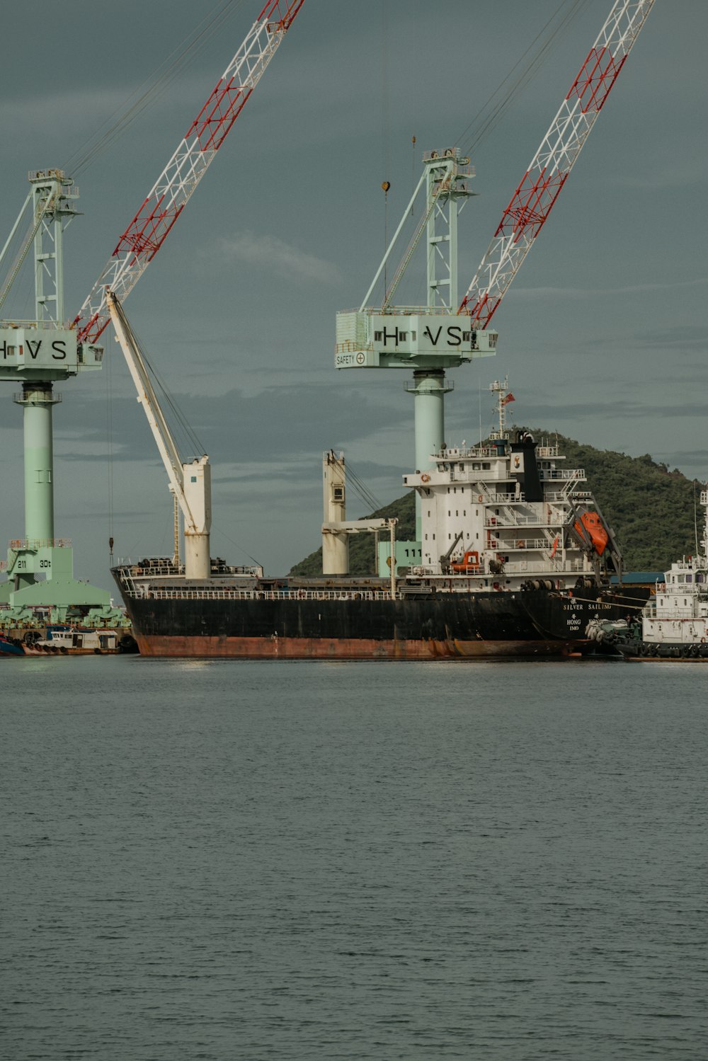 a large ship with cranes on it