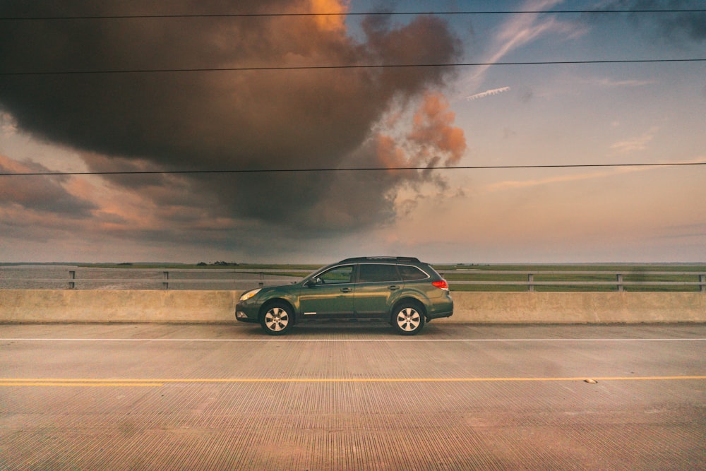 a car on a road with smoke coming out of it