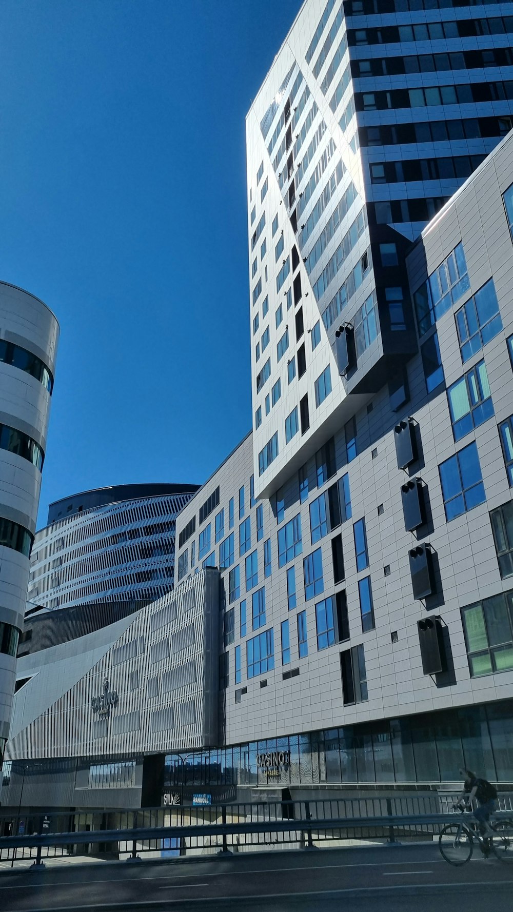 a building with a person riding a bicycle