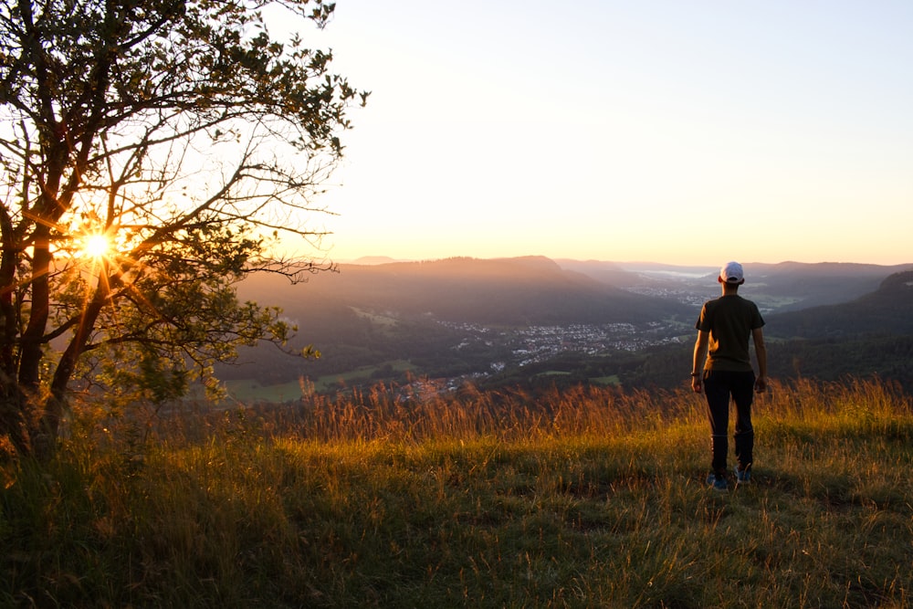 a man standing on a hill