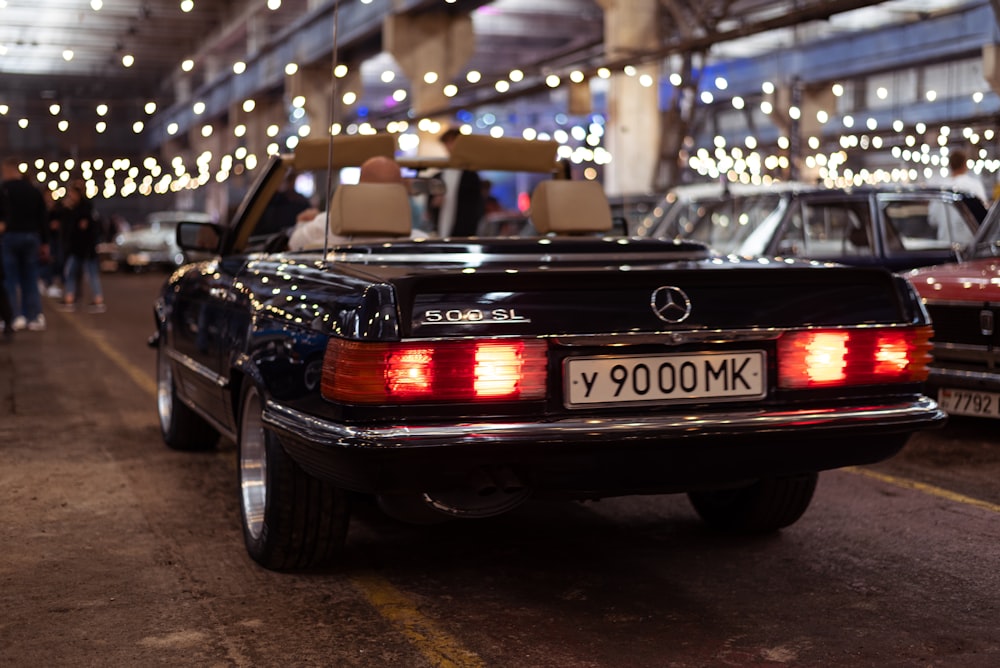 a black car with its lights on