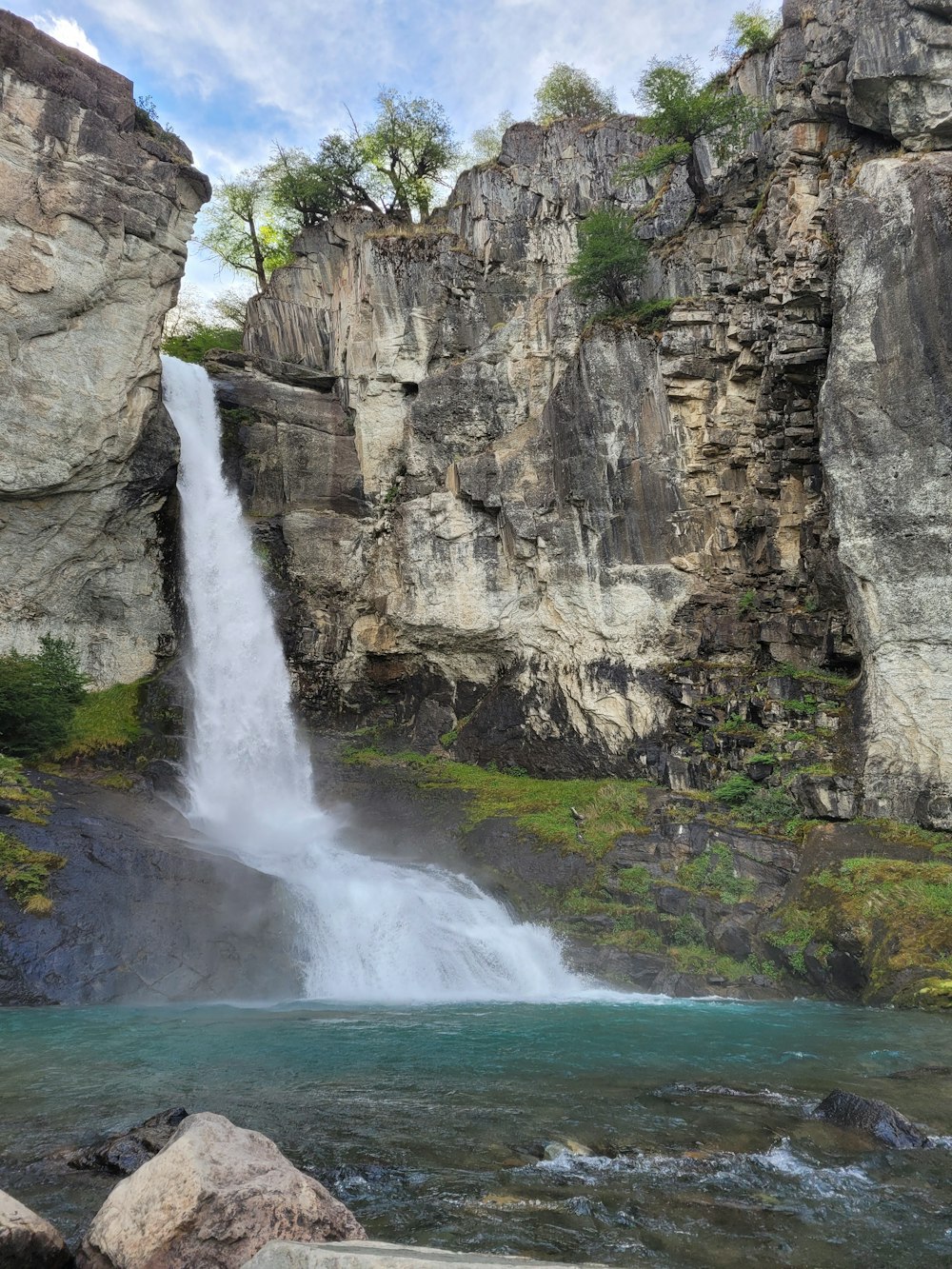 a waterfall over a cliff