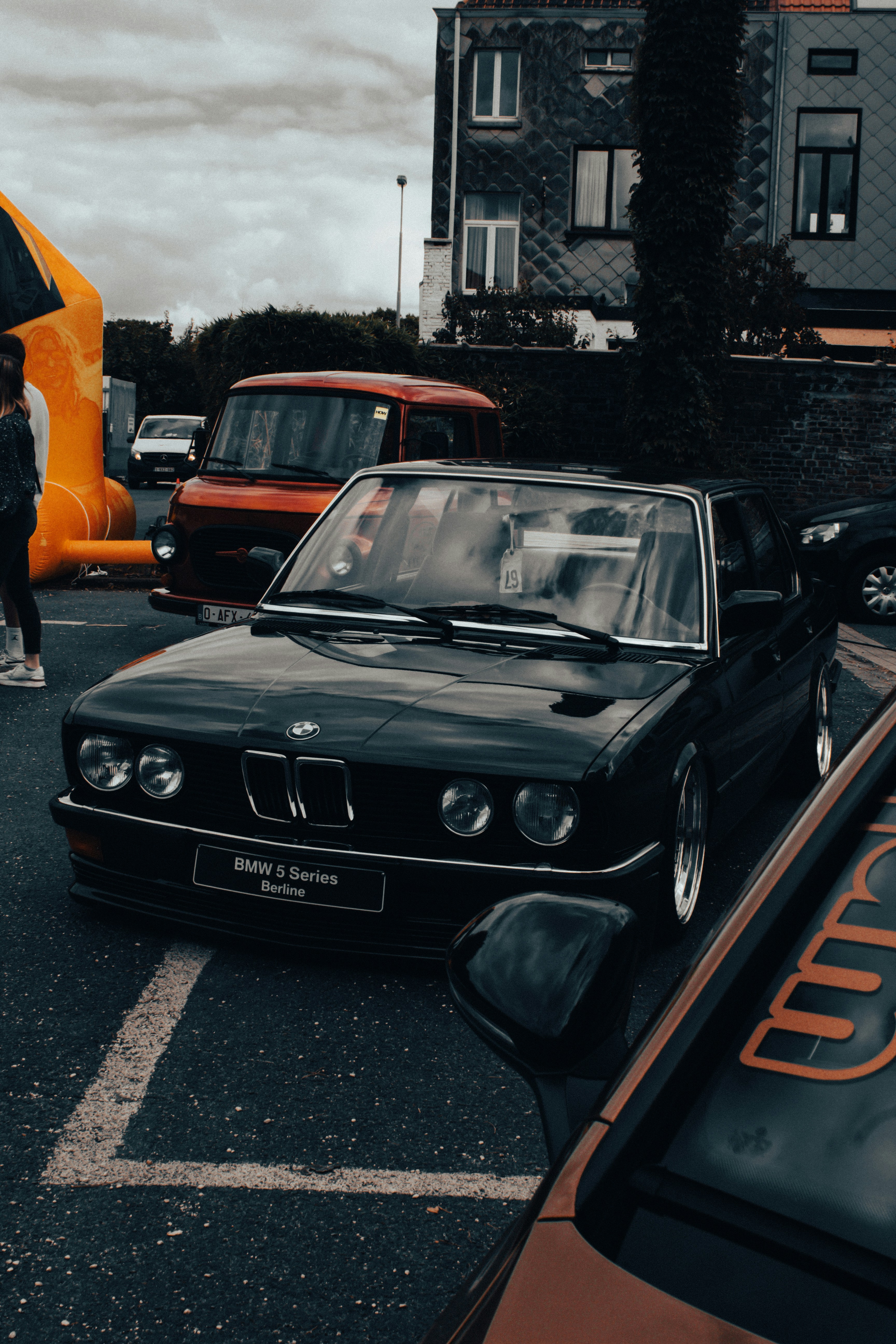 a black car parked in a parking lot