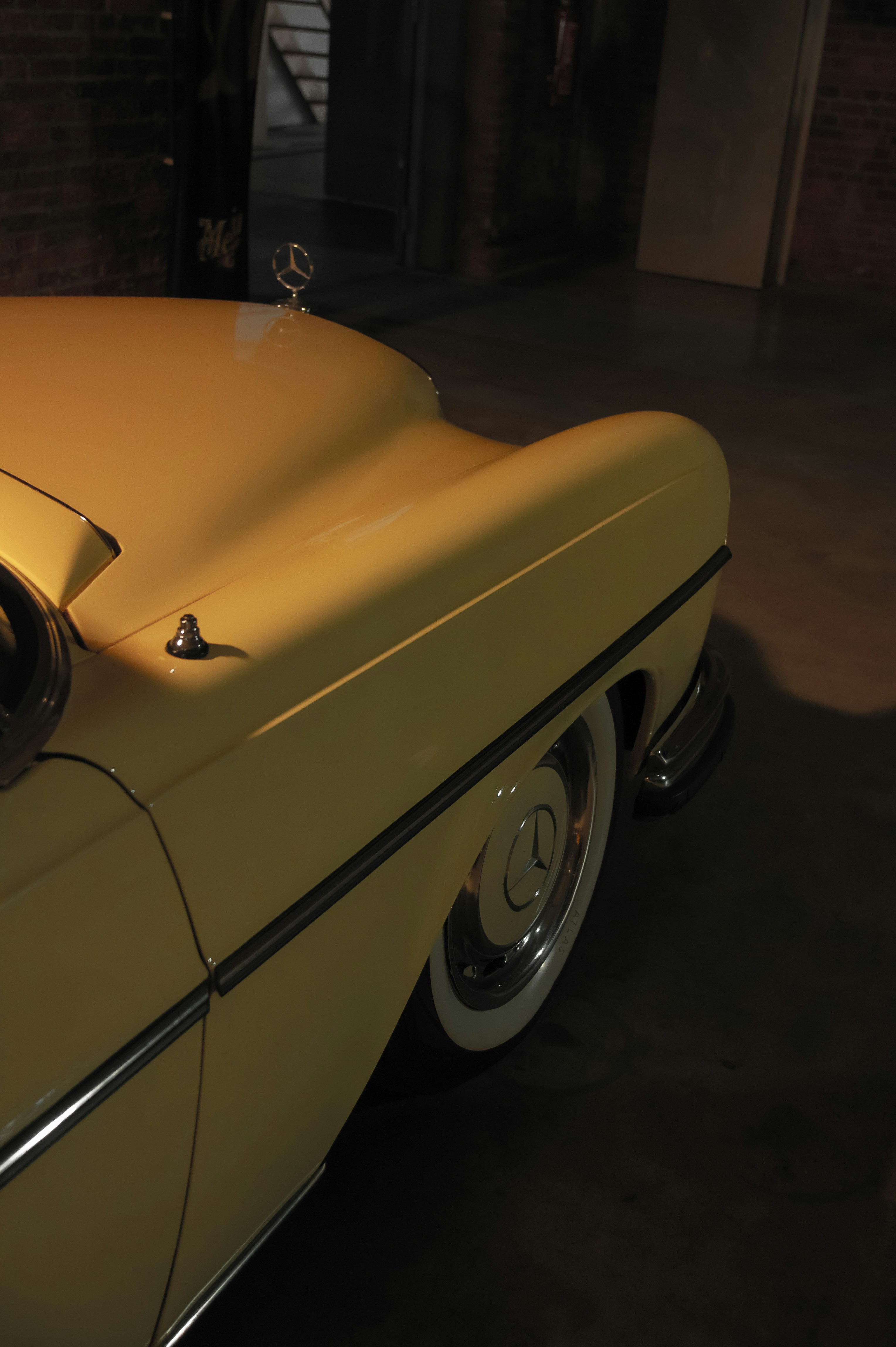 a yellow car with a black top