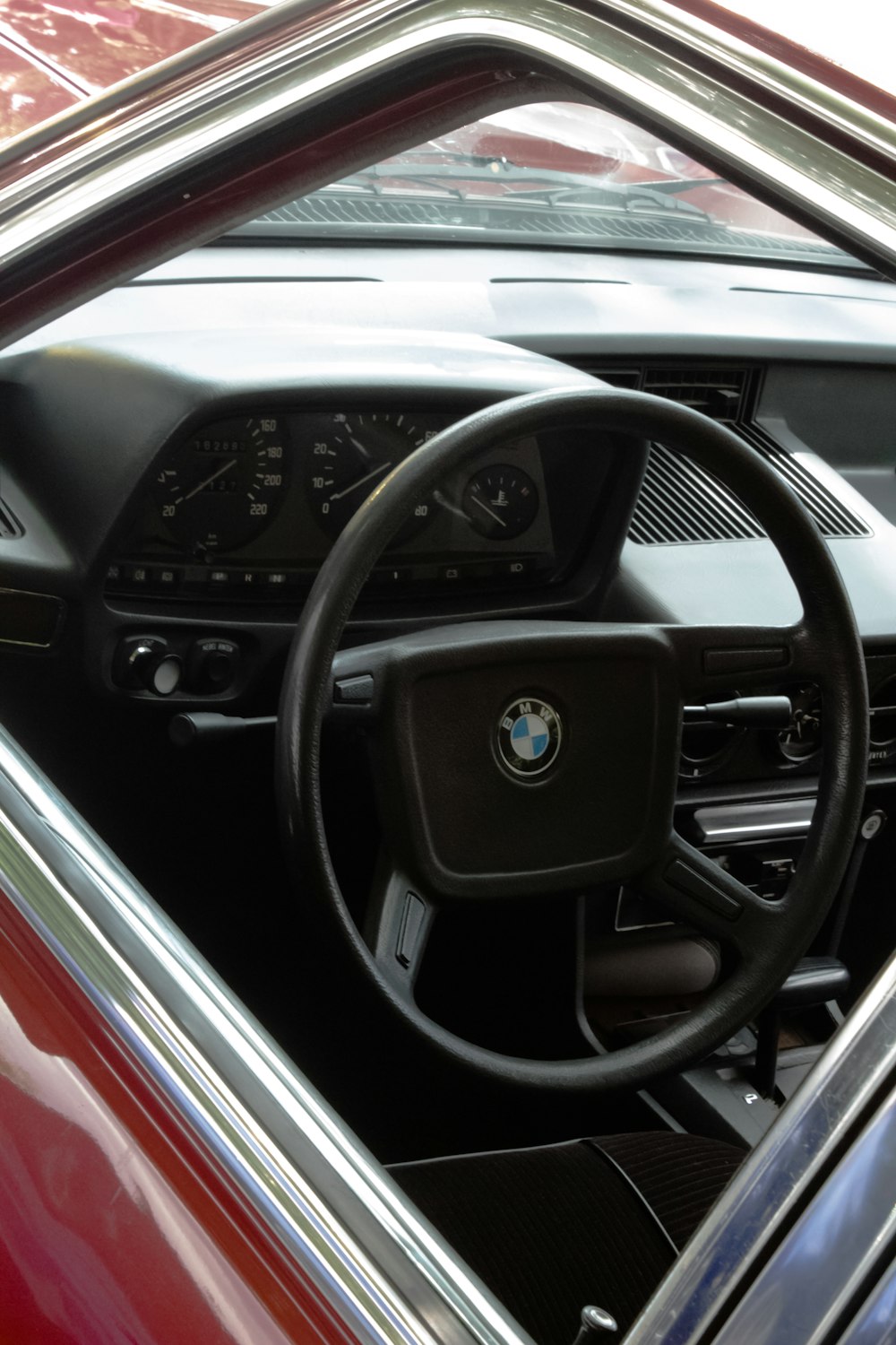 the steering wheel and dashboard of a car