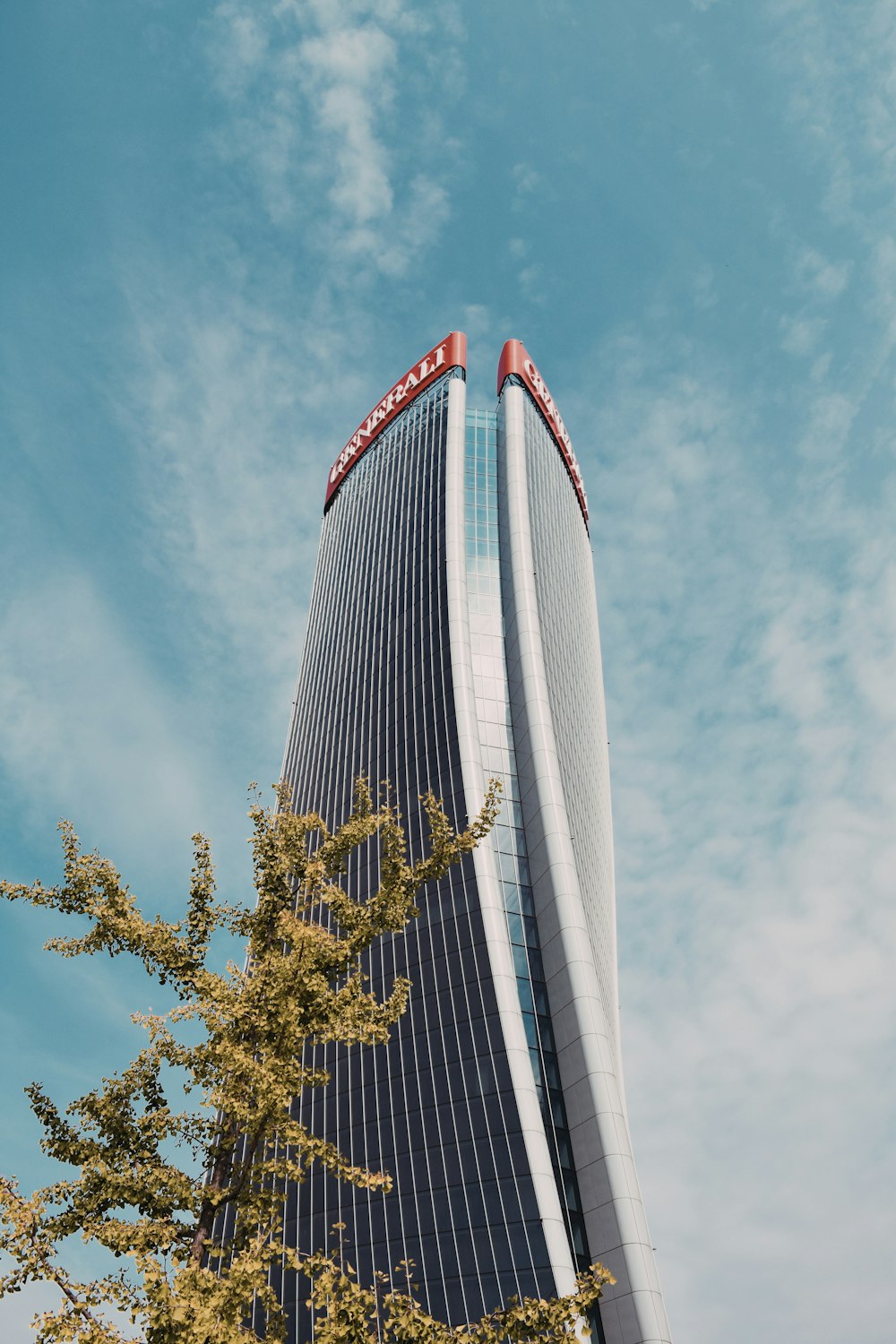 a tall building with a gold cross on the top