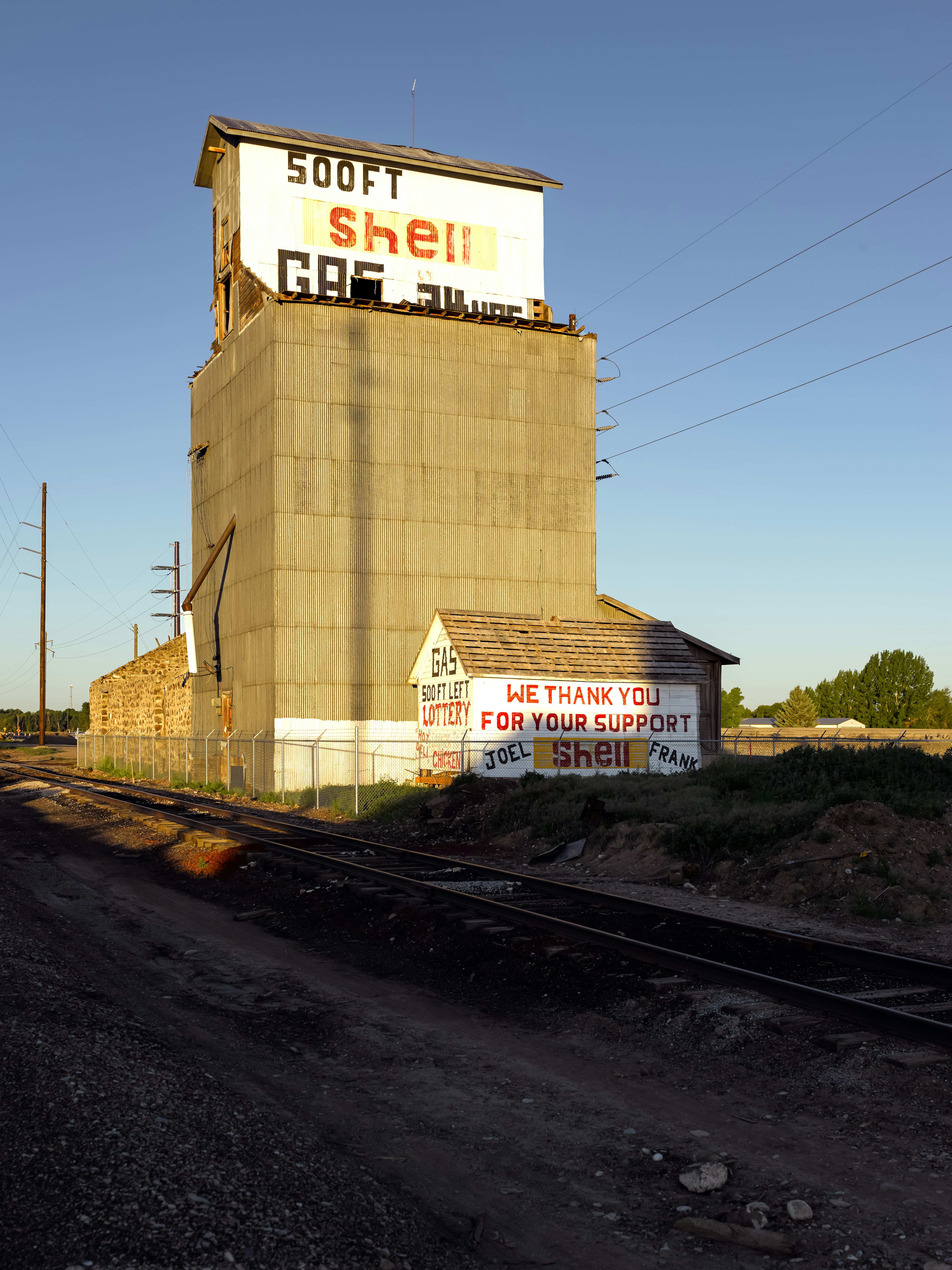 A large building with a sign on it photo – Free Dawn Image on Unsplash