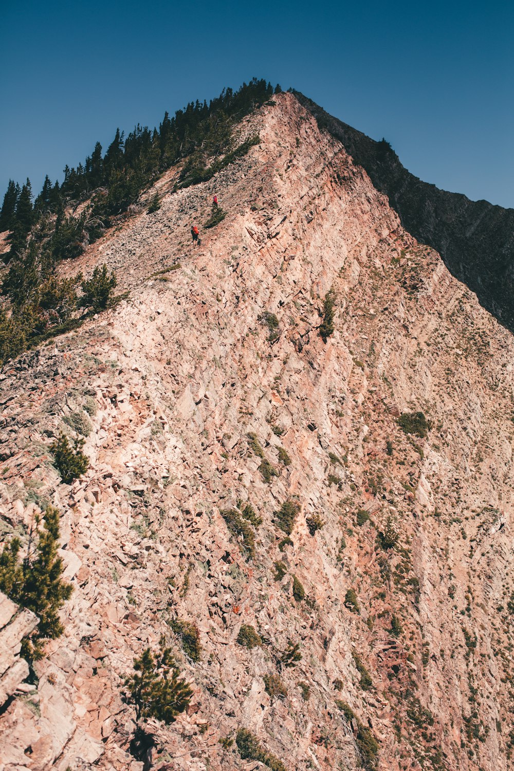 a person climbing a rocky mountain