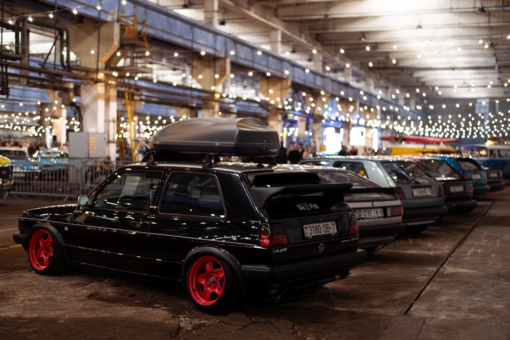 a group of cars parked in a building