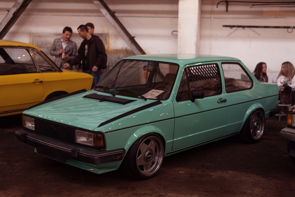 a green car parked in a garage