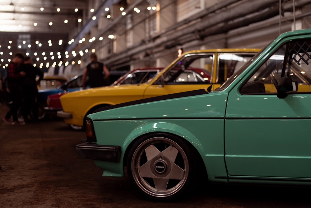 a group of cars parked in a building