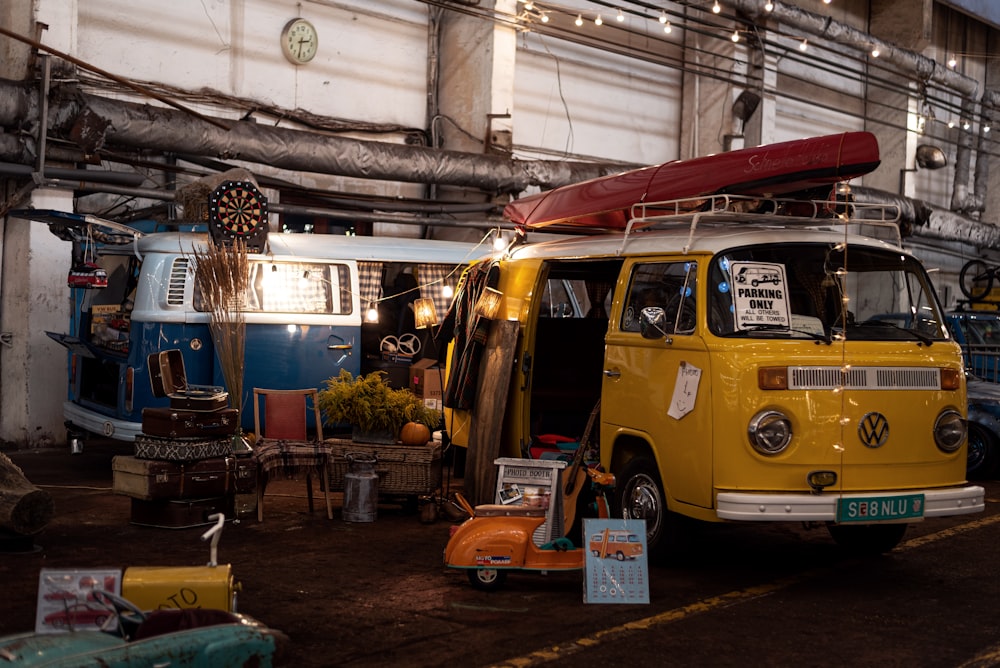 a yellow van with a surfboard on top of it