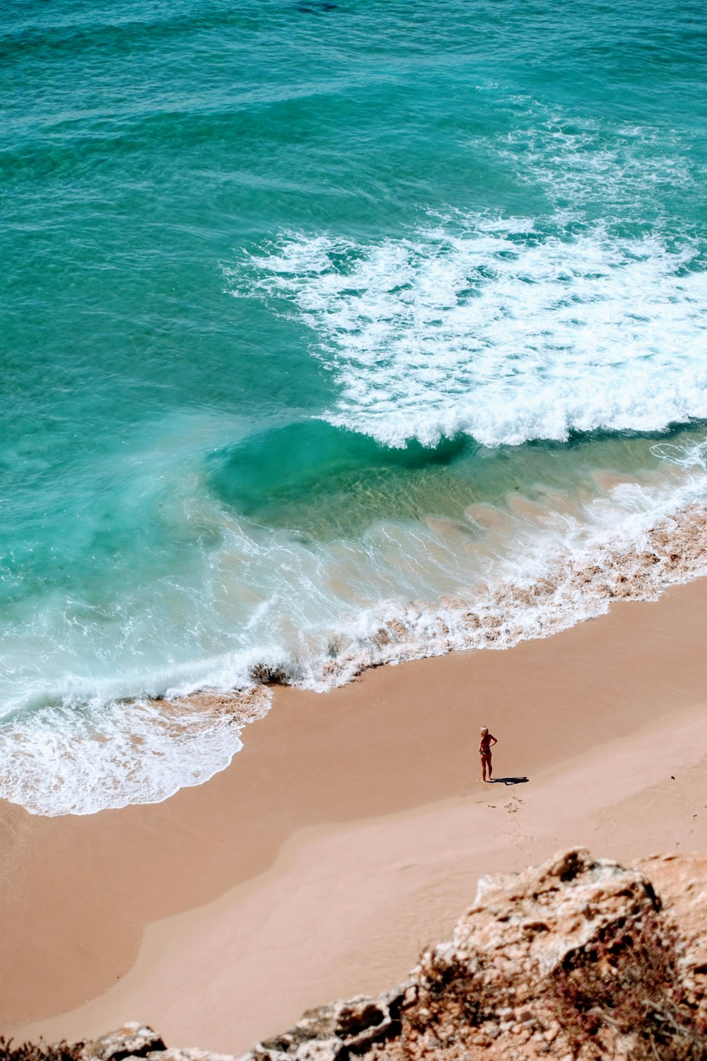 a person standing on a beach