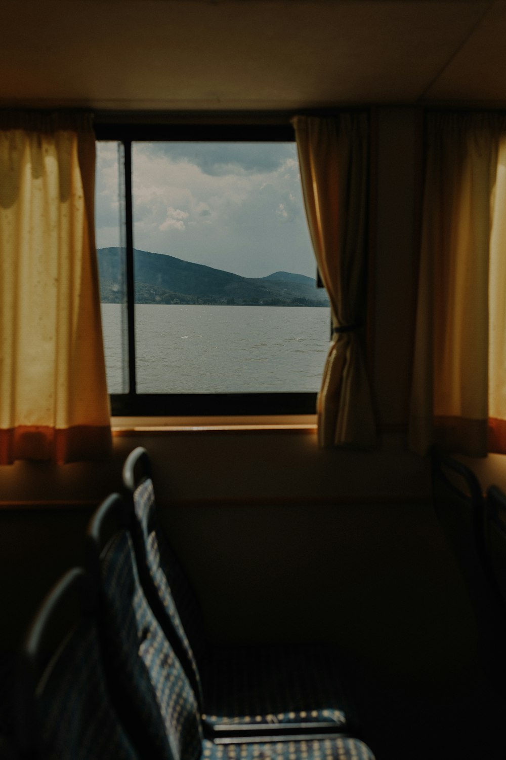 a view of the ocean from a train window