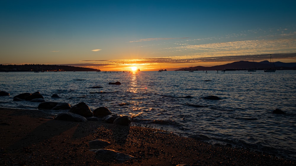 a beach with rocks and water