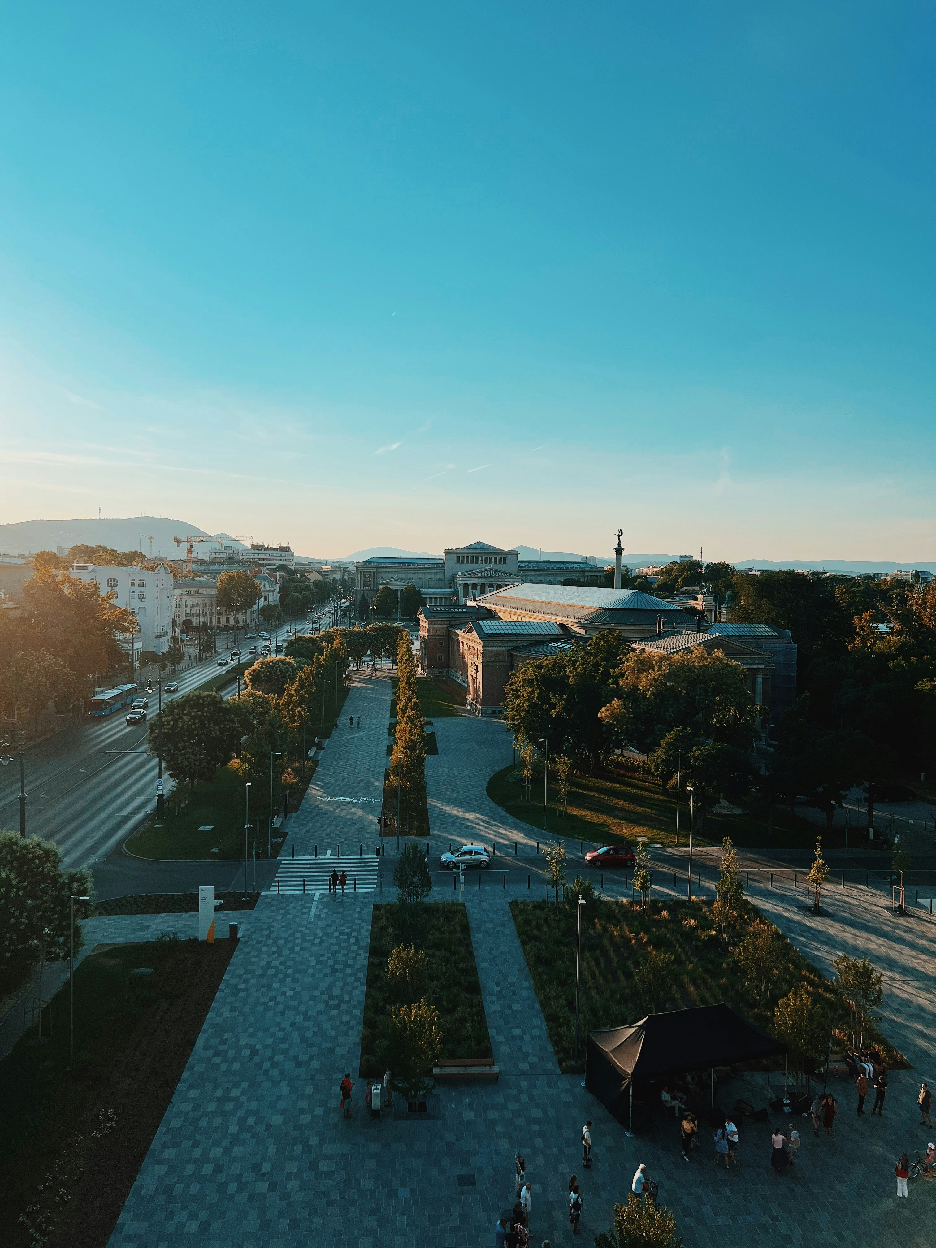 a courtyard with a fountain and people