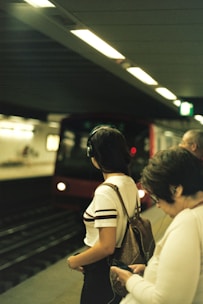 a group of people waiting for a train