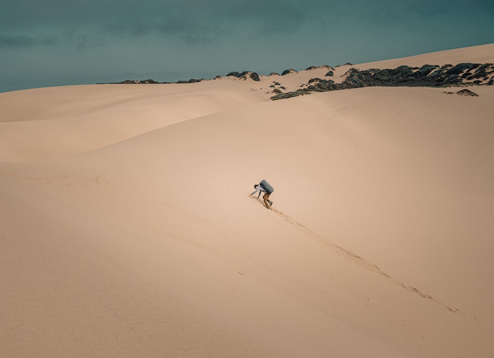 a person walking in the sand