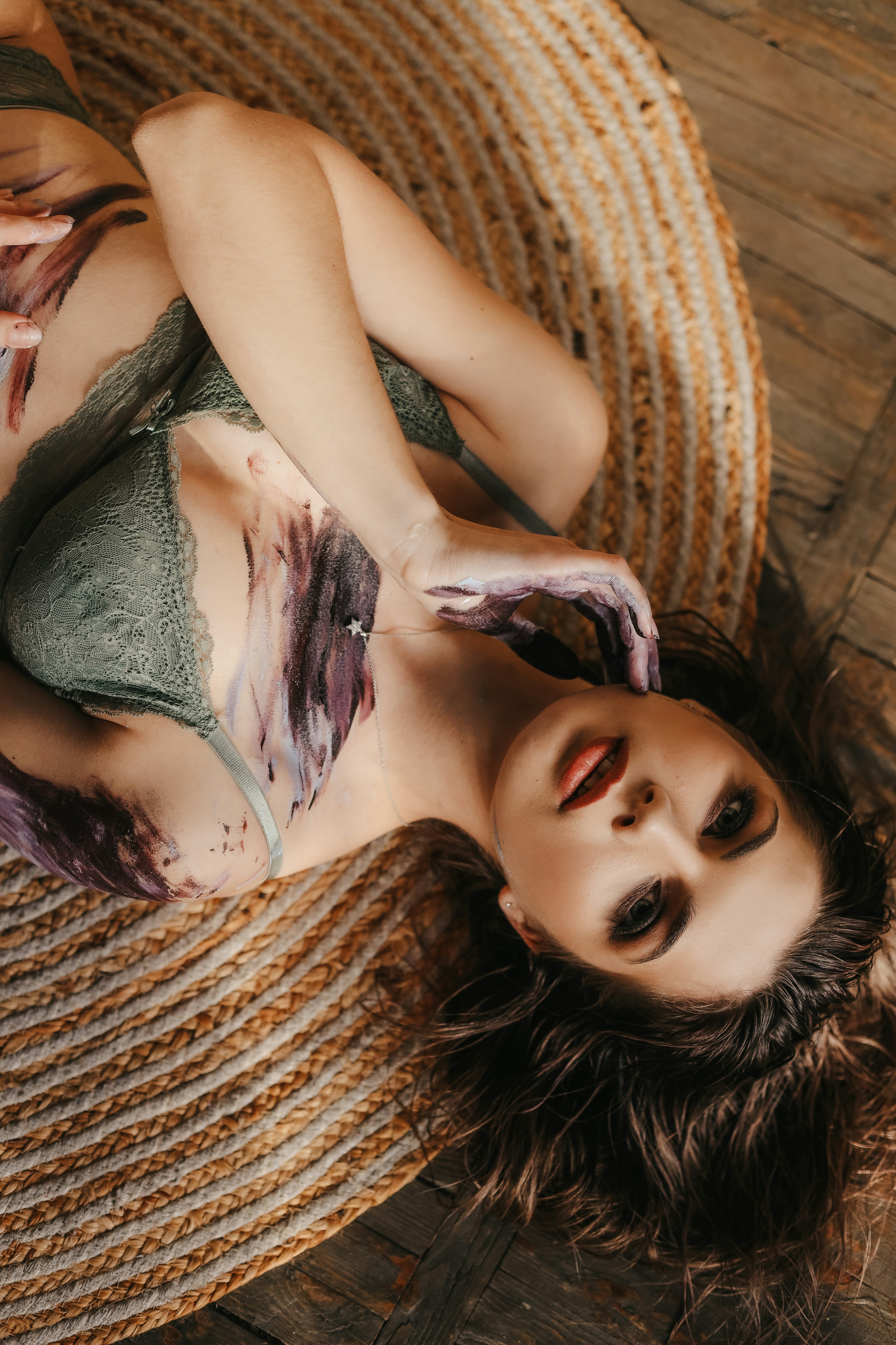 a woman lying on a rug