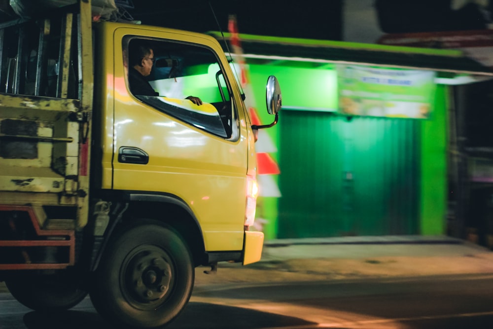 a yellow truck on the street