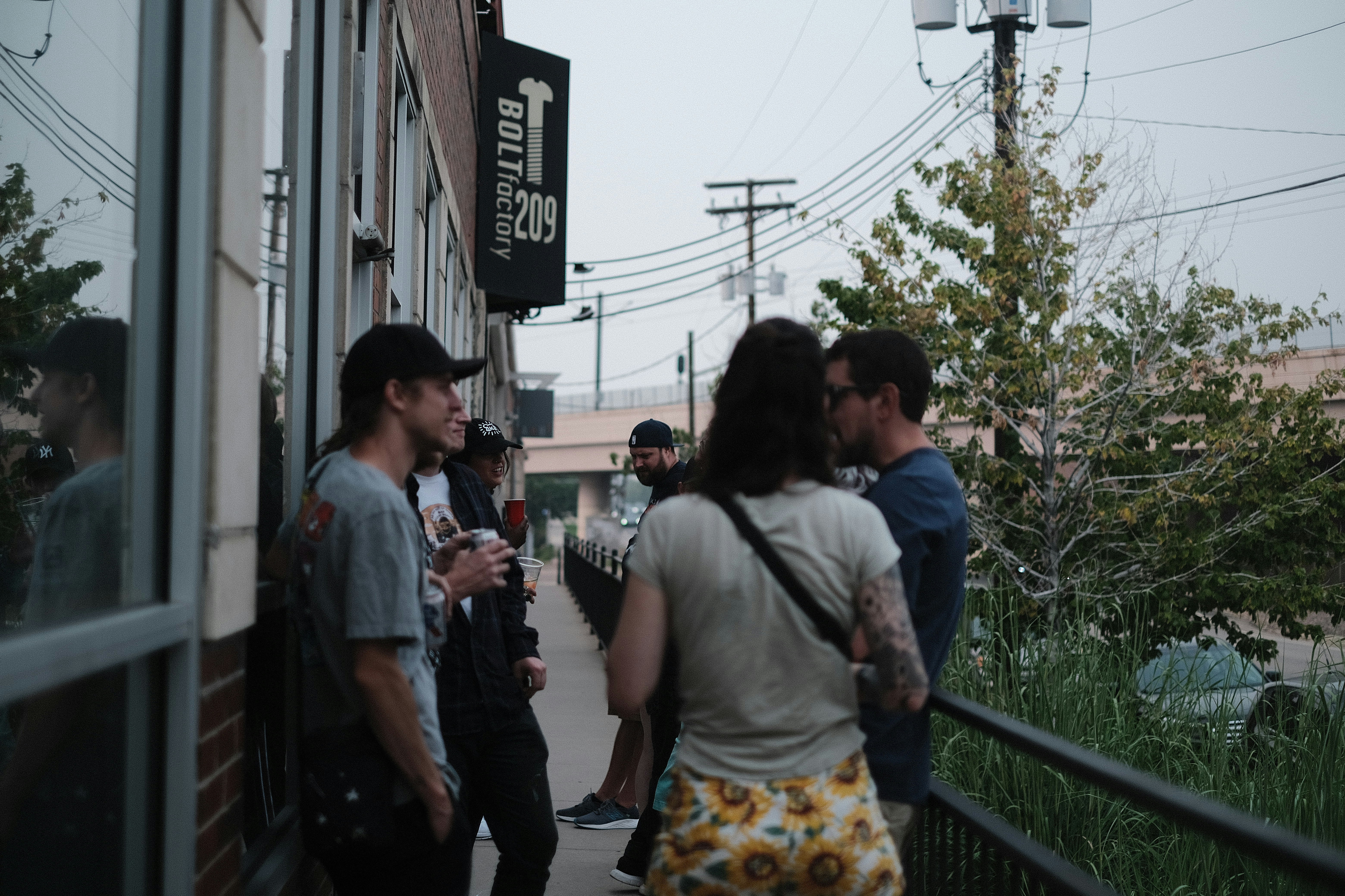 a group of people standing outside a building