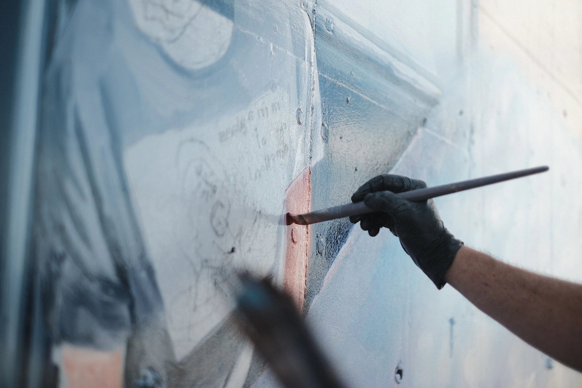 a person painting a wall