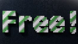 Text is constructed out of LEGO-like bricks spelling 'Free!' with a blend of green and white colors. The background consists of tightly spaced, dark-colored LEGO-like studs.